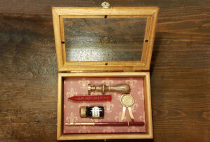 Wooden gift showcases for seals with sealing wax, nib and ink.