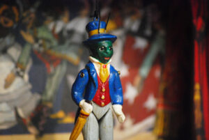 Grillo Parlante, a small terracotta puppet made up of five hand-decorated jointed pieces